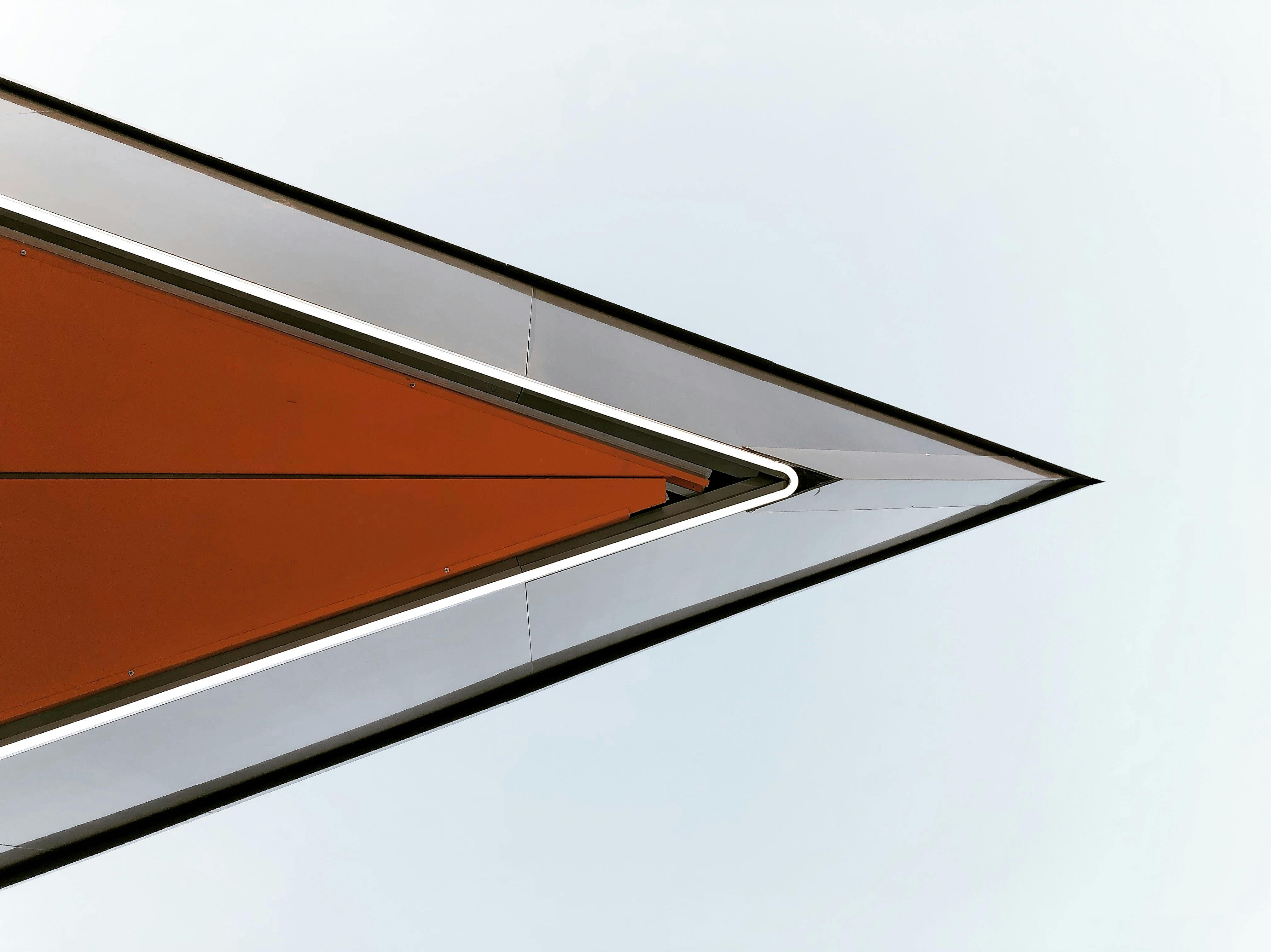 Architectural triangle design with orange and white geometric shapes